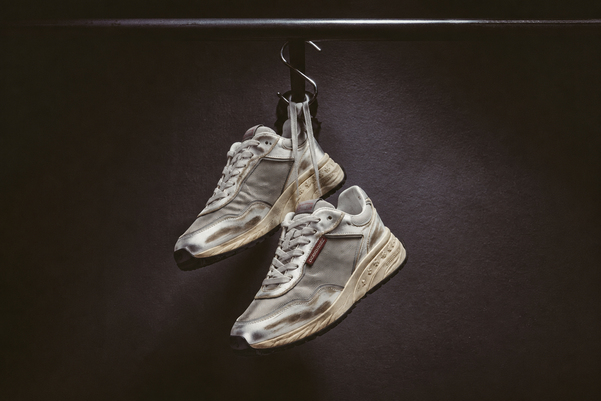 Grey Dsquared2 sneaker composited into original hanging background